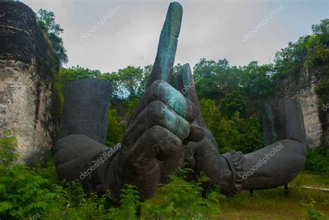 Garuda Wisnu Kencana Cultural Park. Huge hands of a statue of Vishnu ...