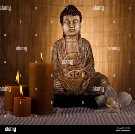 Buddha with candles Stock Photo - Alamy