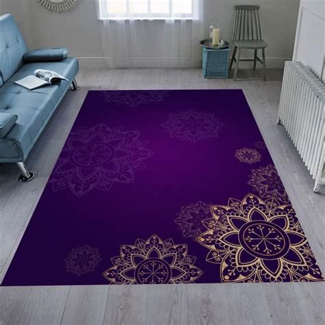 A Living Room Area Rug With Purple And Gold Designs On The Floor Next