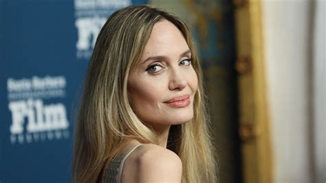 Angelina Jolie Flashes Her Tattoo Collection In A Backless Nude Slip Dress And Slingback Heels