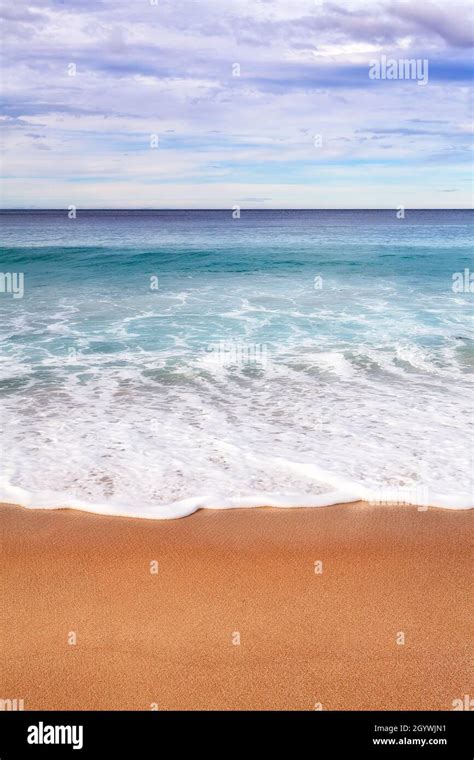 Smooth Gentle Waves On White Sands Of Wineglass Bay Beach In Freycinet Peninsula Of Tasmania