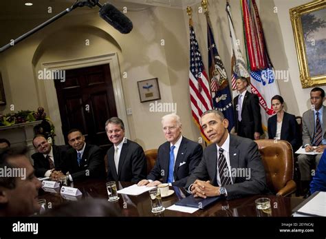 President Barack Obama And Vice President Joe Biden Meet With A Group