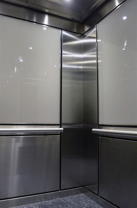 This Durable Elevator Interior Features Brushed Stainless Steel With A