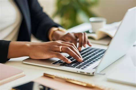 Close Up Photo Of Woman Hands Using Laptop Computer In The Office An