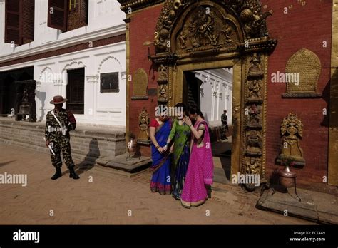 Nepali Soldier And Chinese Tourists At The Golden Gate Sun Dhoka