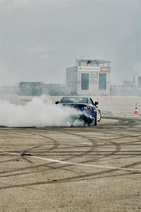 A car is drifting smoke in the air · Free Stock Photo