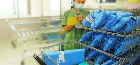 A Woman Wearing A Face Mask Standing Next To A Shopping Cart Filled