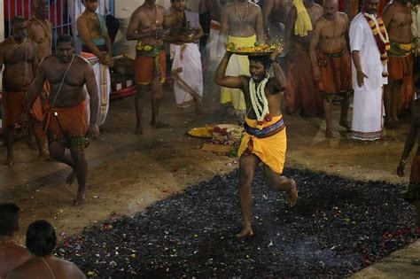 Head priest leads Fire Walking Festival at Sri Mariamman Temple | The ...