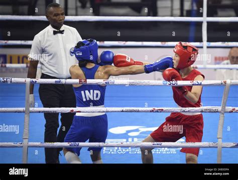 Mary Kom Of India In Blue And Kim Hyang Mi Of North Korea In Red