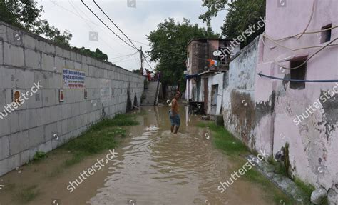 People Wades Across Flooded Street Near Editorial Stock Photo Stock