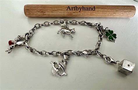 XENOX BETTEL ARMBAND SILBER 925 MIT 5 HÜBSCHEN CHARMS Kaufen auf Ricardo