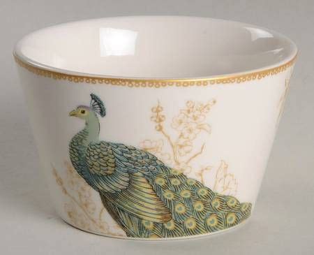 A Bowl With A Peacock Painted On The Side And Gold Trimming Around The Rim