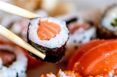 Premium Photo Eating Various Sushi Maki Uramaki Hosomaki E Nigiri