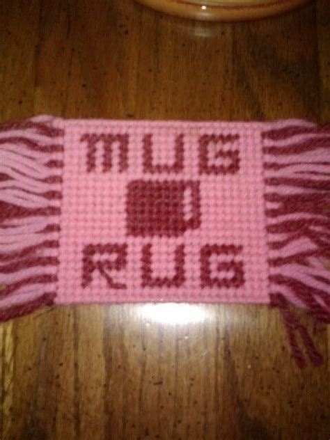 A Knitted Scarf With The Words Hugs And Kisses On It Sitting On A Wooden Table