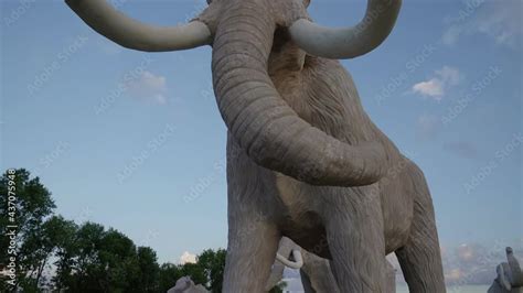 Video Stock From Below Motion Of Huge Sculptures Of Extinct Mammoths