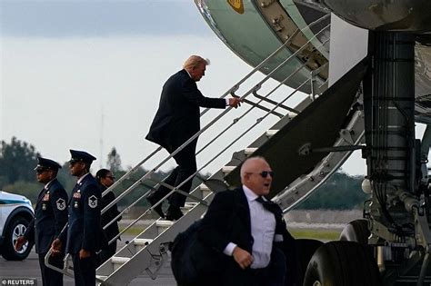 Trump boards Air Force One via small stairs due to security