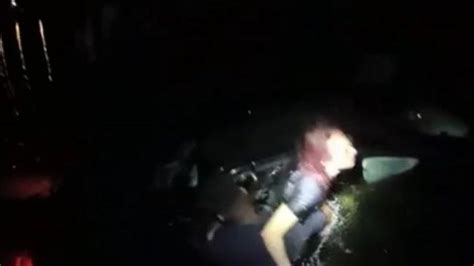 Florida Police Officer Rescues Panicked Woman From Fast Sinking Car