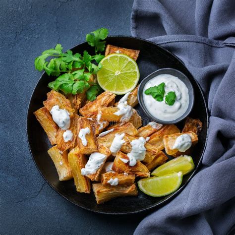 Fried Yucca Yuca Cassava Manioca Mandioca With Cilantro Sauce Stock