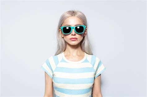 Premium Photo Studio Portrait Of Pretty Blonde Girl In Striped Shirt