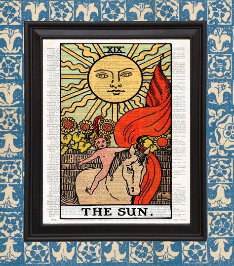 the sun tarot card on an old book page with blue and white wallpaper