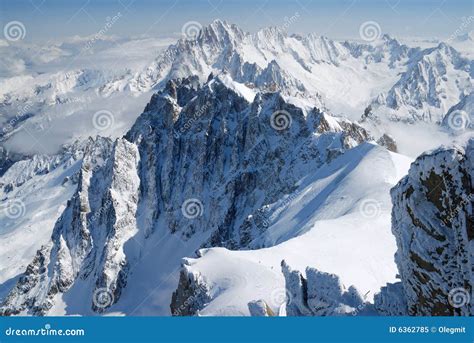 Mountain Range among Snow and Clouds, the Alps Stock Image - Image of ...