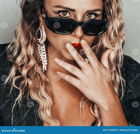 Beautiful Blonde Woman In Provocative Attitude Lighting A Lighter To Smoke Stock Image Image