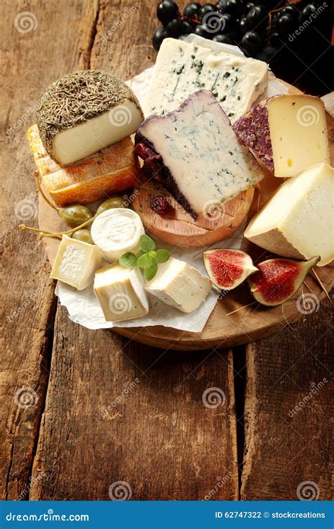 Assortment of Speciality Cheeses on a Platter Stock Photo - Image of ...