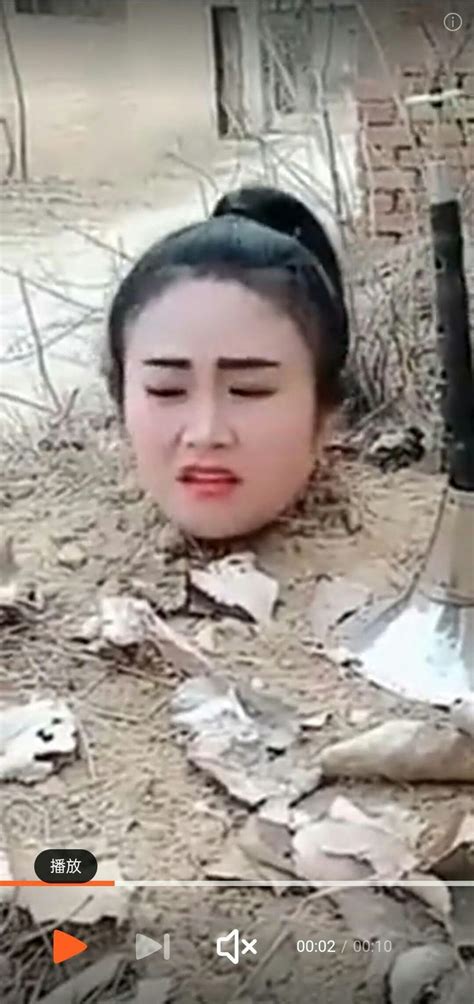 Women Buried Up To Her Neck In The Ground Dirt