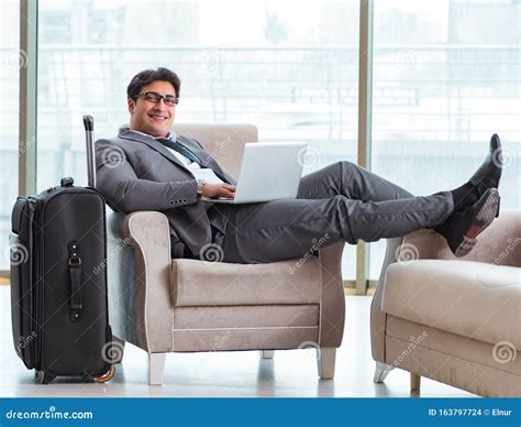 Young Businessman In Airport Business Lounge Waiting For Flight Stock