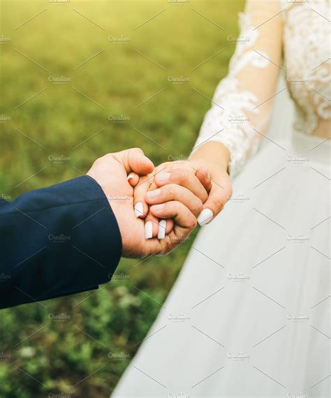 Groom And Bride Are Holding Hands Featuring Groom Bride And People