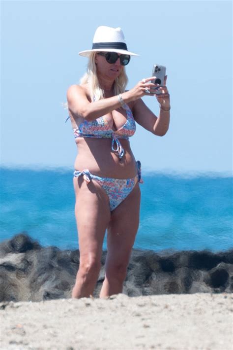 Denise Van Outen Wearing A Blue Floral Bikini On The Beach In