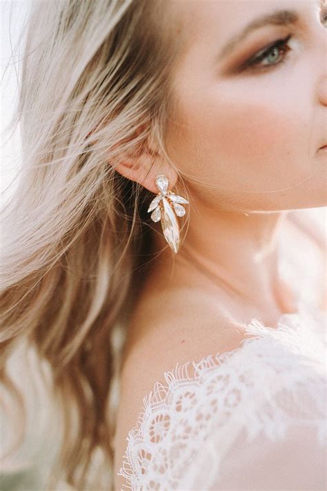 Modern Bride Wearing Statement Crystal Earrings With Smokey Eye