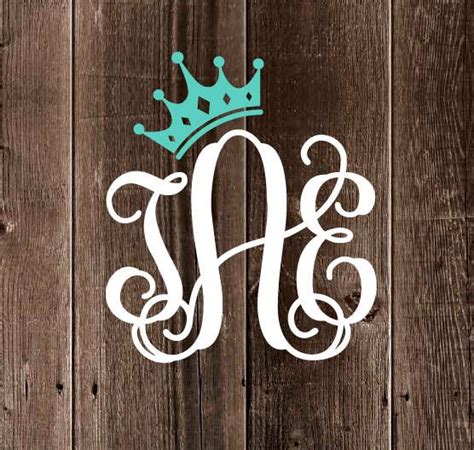 A Wooden Wall With A Monogrammed Letter And A Blue Crown On The Top