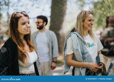 Multiracial Group Of Friends Enjoying Free Time Together In A Park