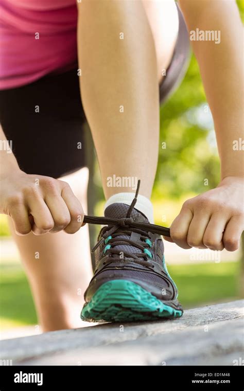 Fit Woman Tying Her Shoelace Stock Photo Alamy