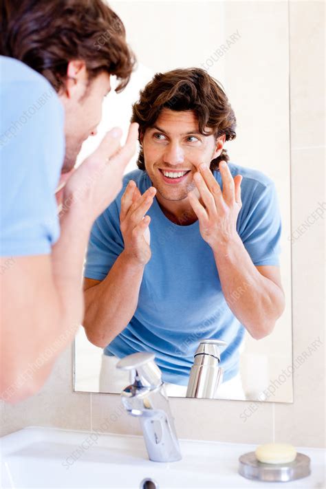 Man Checking His Face In Mirror Stock Image C0330749 Science