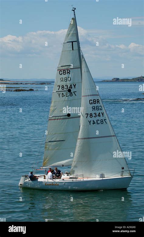 Yacht With White Sail Sailing In Forth Estuary North Sea East Coast