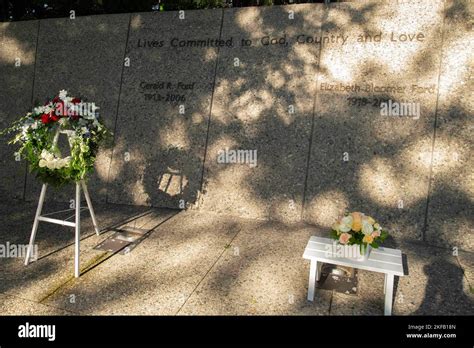 A Wreath And Flower Arrangement Are Displayed At The Tombs Of Former