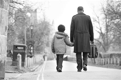 Father Walking Son To School Along Path Safe And Just Michigan