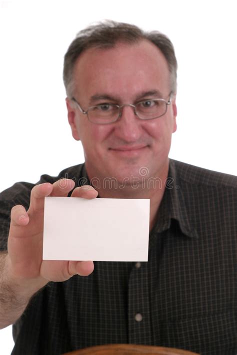 Hombre Sonriente Que Sostiene La Tarjeta En Blanco Imagen De Archivo