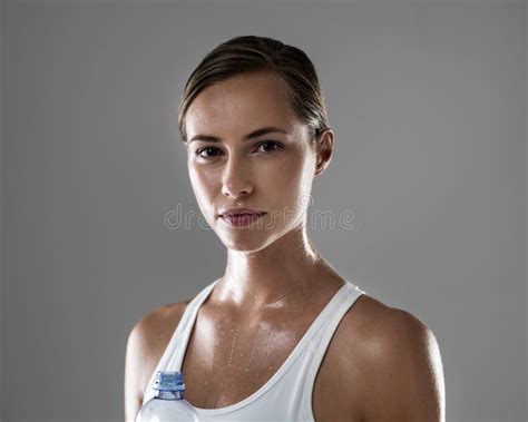 Feeling Great And Looking It Portrait Of A Confident Brunette Taking A Water Break During Her