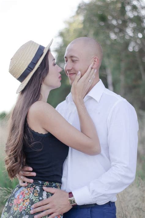 A Brunette And A Bald Middle Aged Man Sit At A Round Table Near A Window Woman Something Fun