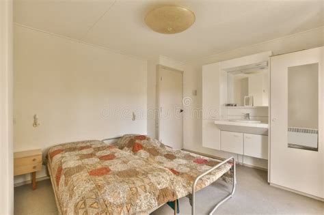 A Bedroom With A Bed And A Sink Stock Photo Image Of Table Sink