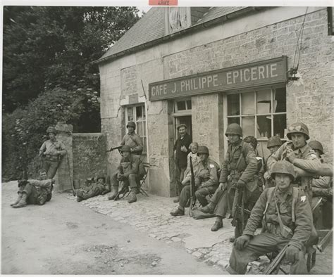 Us Soldiers Relax For A Few Minutes Outside A French Caf In Normandy