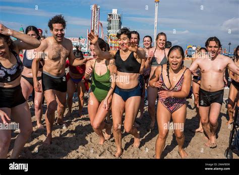 Brooklyn New York January 1 2024 Group Running Into The Ocean