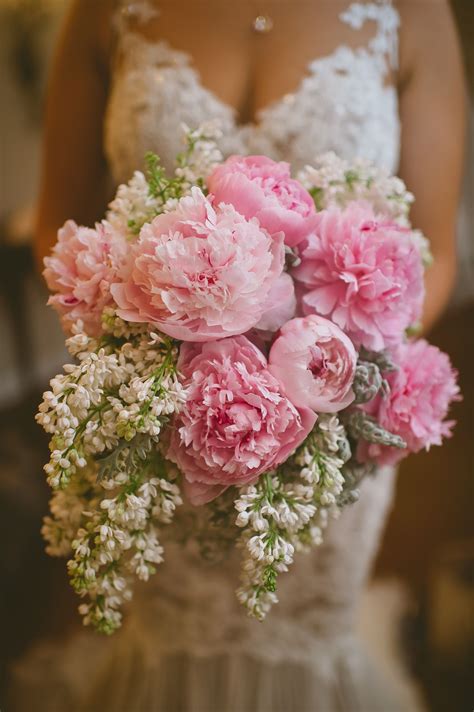 This Delicate Brides Bouquet Features Peonys And Lilac For A Stunning