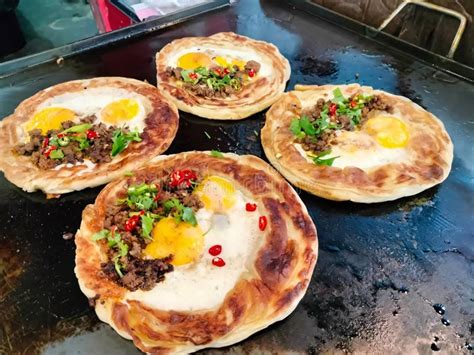 Hot Off The Griddle Delicious Malaysian Roti Canai With Eggs And Minced Meat Stock Image