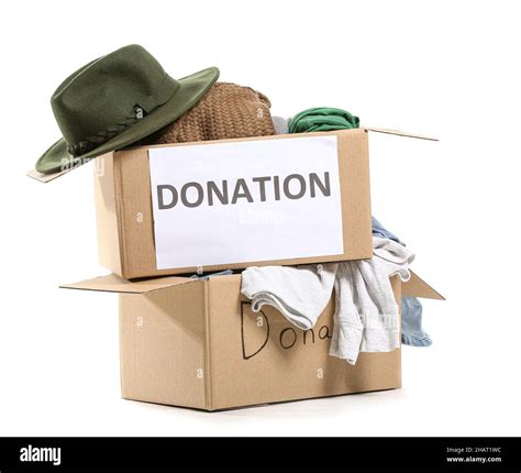 Cardboard Boxes With Donation Clothes On White Background Stock Photo