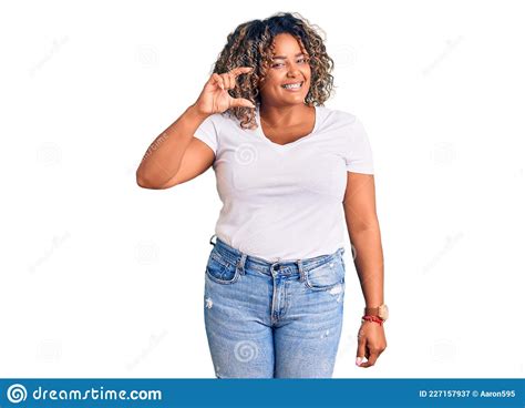 Young African American Plus Size Woman Wearing Casual Clothes Smiling