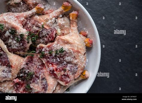 Raw Wild Mallard Legs That Have Been Left To Marinade In Salt And Herbs